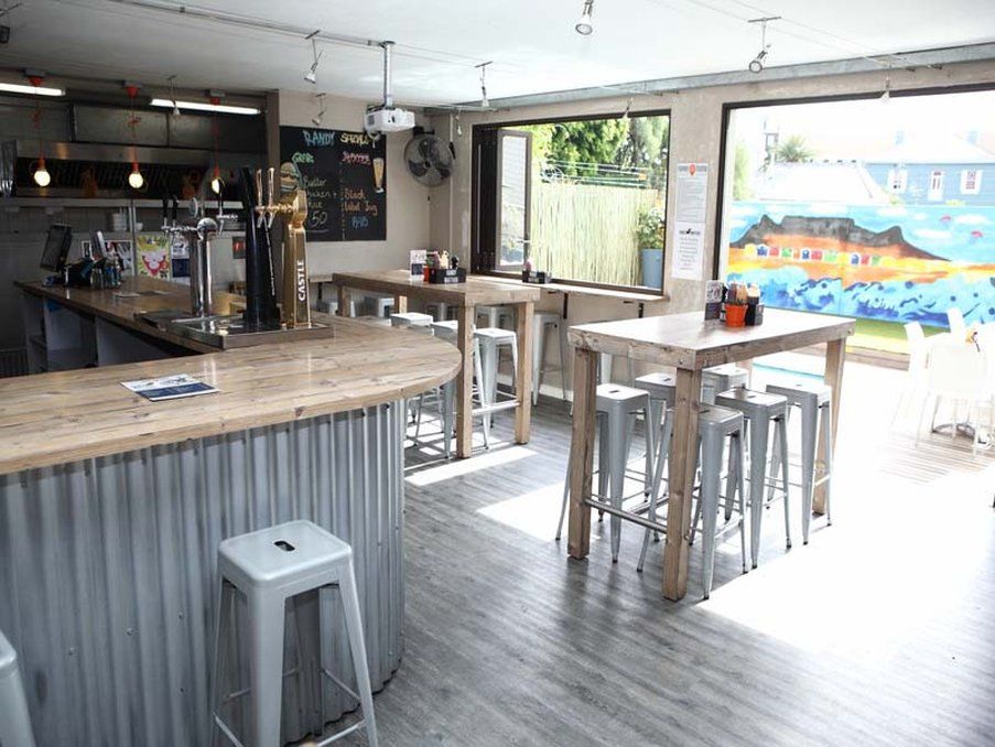Never at Home Green Point Kaapstad Buitenkant foto The interior of the bar